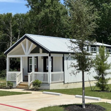 A charming tiny home cabin with modern features and a private patio, perfect for a weekend getaway or intimate retreat at Chuck’s RV Resort in Mabank, TX